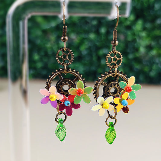 Boucles d'oreilles Oliver le jardinier - Fleurs irisées, steampunk et engrenages enchantés (La Clairière des Âmes Ferrées)