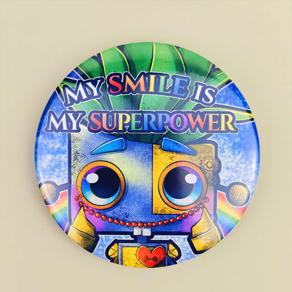 Badge 58mm "My smile is my superpower" – Sparky et son sourire - Kawaii fantasy arc-en-ciel (La Clairière des Âmes ferrées)
